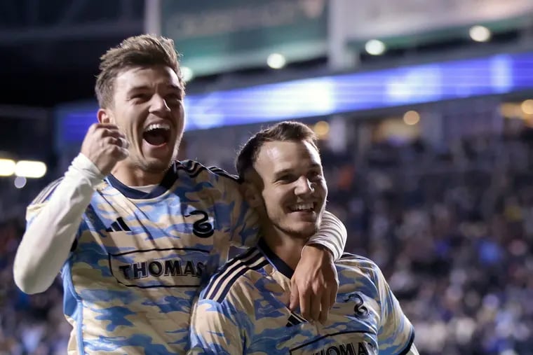 Union's Kai Wagner celebrates the Union's third goal of the game with goal scorer Daniel Gazdag during the second half of the Columbus Crew vs. Philadelphia Union Major League soccer match at Subaru Park in Chester, Pa. on Sat. Feb. 25, 2023.