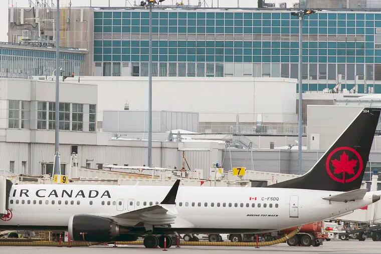 An Air Canada Boeing 737 Max 8 aircraft is parked next to a gate at Trudeau Airport in Montreal, Wednesday, March 13, 2019. (Graham Hughes/The Canadian Press via AP)