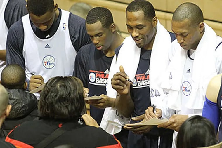 76ers players signed autographs for fans after last night's open practice at the Palestra. (Charles Fox/Staff Photographer)