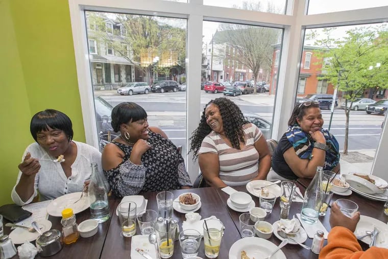From left, Shirley Morrison, LaRissa Miller, Cynthia Taylor, and Rhonda Washington enjoy dinner at EAT Cafe.