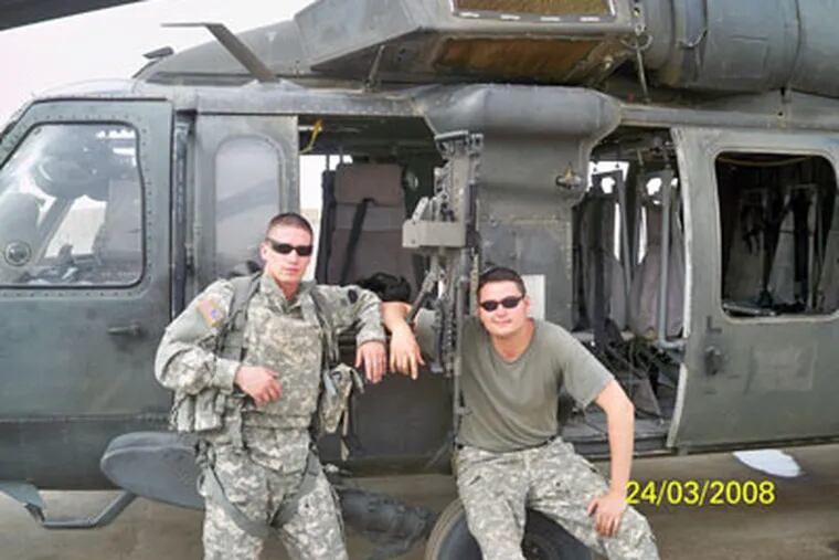 Nick Miccarelli III (right) had been just sworn in as Delco state representative when he was deployed to Iraq. Here he is with his chopper and Lt. Mark Martella in Basara.