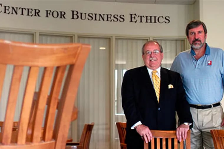 St. Joseph's University Dean Joseph A. DiAngelo and John J. McCall, Director of the Pedro Arrupe Center for Business Ethics, are helping colleges change the way they teach ethics (Tom Gralish / Inquirer)