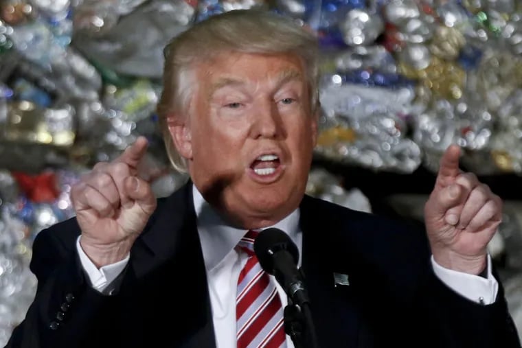 Then Republican presidential candidate  Trump speaks during a campaign stopat Alumisource, a metals recycling facility in Monessen, Pa.