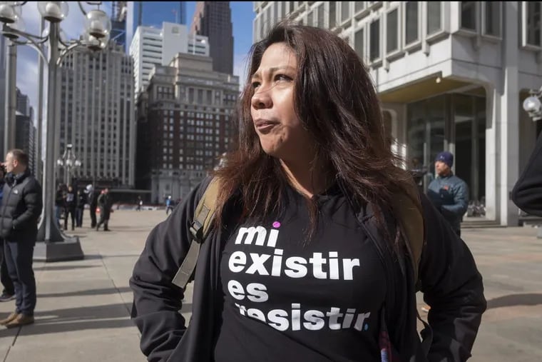Brenda Hernandez wore a shirt that said “my existence is resistance” at a  Day Without Immigrants rally in February at Philadelphia’s Municipal Services Building.