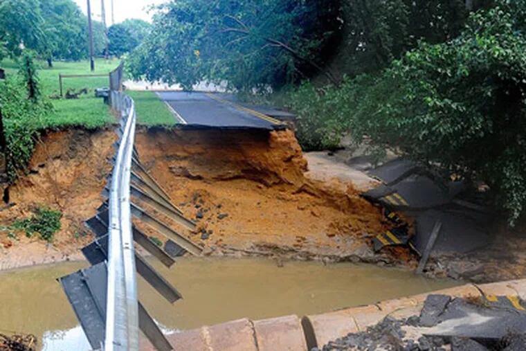 Beebe Run Road is washed out near Bridgeton, Cumberland County. The area got over 10 inches of rain Aug. 13-14, according to some reports. (Clem Murray / Staff Photographer)