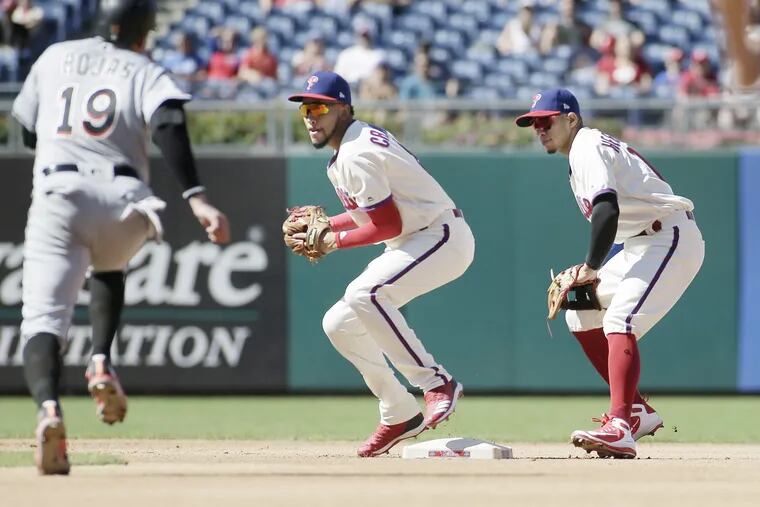 J.P. Crawford and Cesar Hernandez both covered second base in the fourth inning when the Marlins' Starlin Castro hit a ground ball back to pitcher Nick Pivetta. Crawford got the out at second, but his throw to first was so bad, Castro ended up advancing to second base.