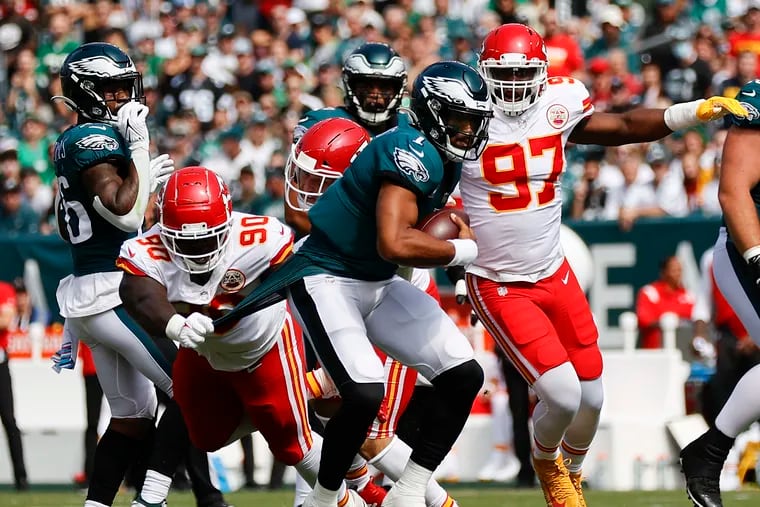 Eagles quarterback Jalen Hurts gets his jersey pulled by Kansas City Chiefs defensive tackle Jarran Reed in the first quarter on Sunday, October 3, 2021 in Philadelphia.