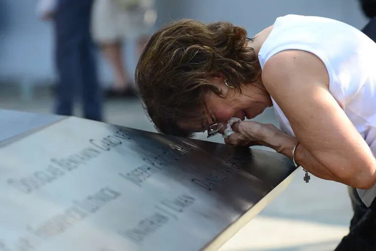 Geraldine Davie of Pelham, N.Y., cries after viewing the name of her 23-year-old daughter, Amy O'Doherty, on the wall at the Sept. 11 memorial in New York City.