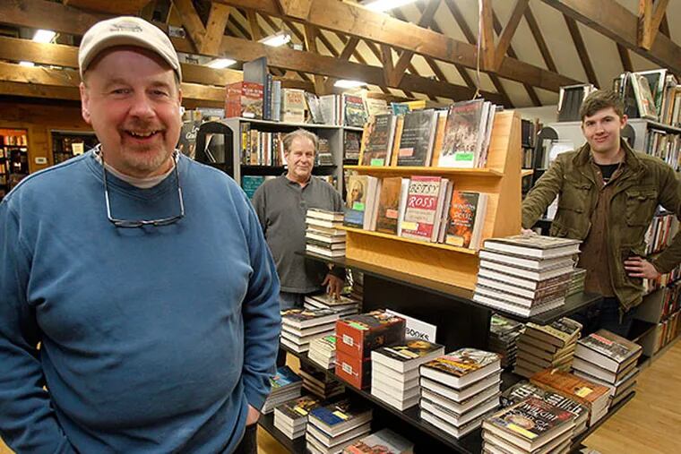 Owner of Second Time Books, Jim Morel, left, and his workers Keith Carmelia, center, and James Bevan, right, at Second Time Books. ( AKIRA SUWA  /  Staff Photographer )