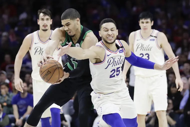 Celtics forward Jayson Tatum grabs the loose basketball past the Sixers’ Ben Simmons during the fourth quarter of Game 3 on Saturday.
