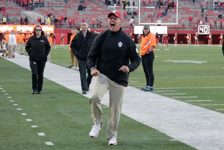 Indiana head coach Tom Allen runs to celebrate with supporters Indiana's 38-31 win over Nebraska on Oct. 26.