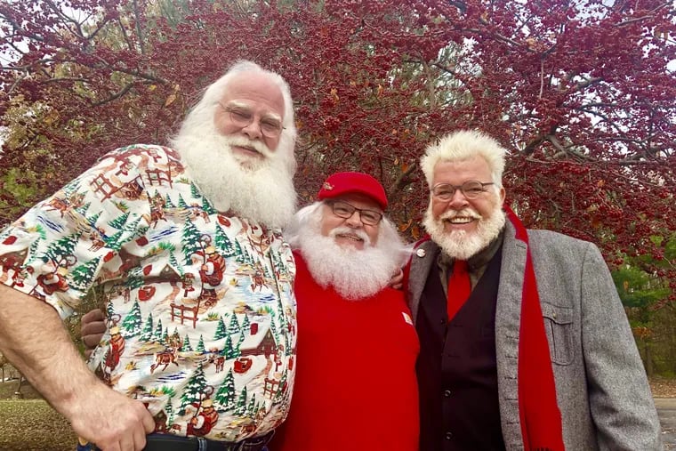 The South Jersey Santas (left to right) Les Jamerson, Kevin Chesney and Chuck Gill find the role is a moving experience.