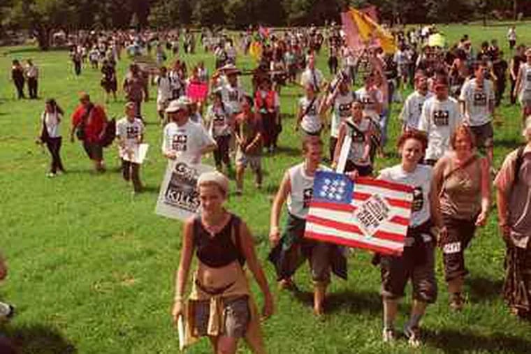 A Broad Street march ends peacefully at FDR Park in 2000. A day later, police arrested about 470 who planned to protest as the GOP gathered.