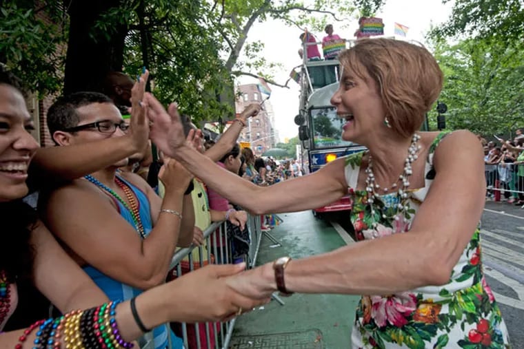 At the Gay Pride parade in New York City, NJ gubernatorial candidate Barbara Buono shakes hands on June 30, 2013.  ( APRIL SAUL / Staff )