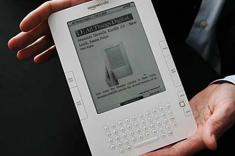 Amazon.com's new Kindle e-reader improves on the original in some aspects, but the price hasn't changed. (Mark Lennihan/AP)