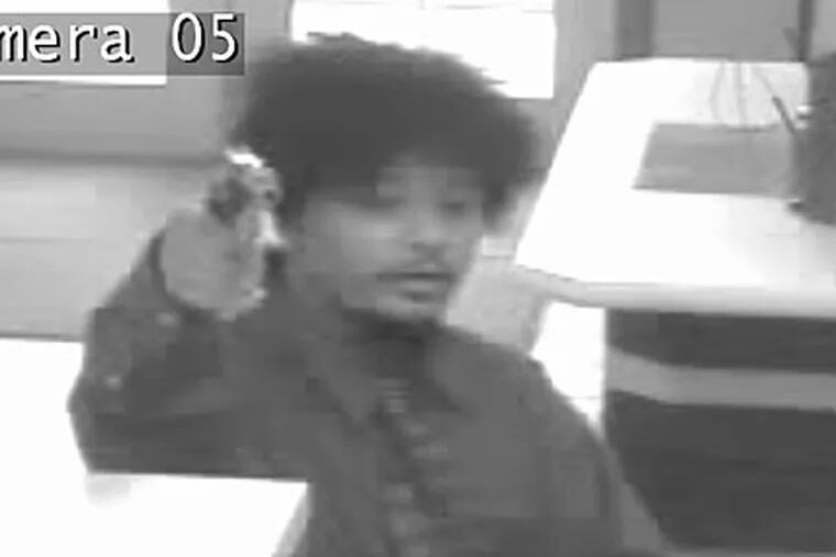 A surveillance photo of one of the suspects in the robbery of the Artisans Bank in Bear, Del.