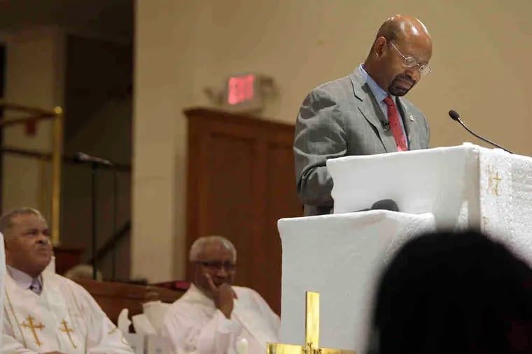 Mayor Nutter pauses during his presentation. He was married at Mount Carmel and grew up nearby. On Friday, he asked the Rev. Albert F. Campbell (left) for permission to speak.