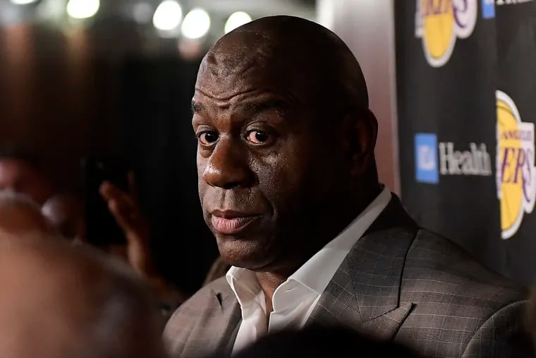 Magic Johnson speaks to reporters prior to an NBA basketball game between the Los Angeles Lakers and the Portland Trail Blazers on Tuesday, April 9, 2019, in Los Angeles. Johnson abruptly quit as the Lakers' president of basketball operations Tuesday night, citing his desire to return to the simpler life he enjoyed as a wealthy businessman and beloved former player before taking charge of the franchise just over two years ago. (AP Photo/Mark J. Terrill)