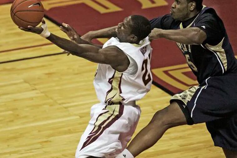 Toney Douglas (left) is fouled by Pitt&#0039;s Tyrell Biggs.