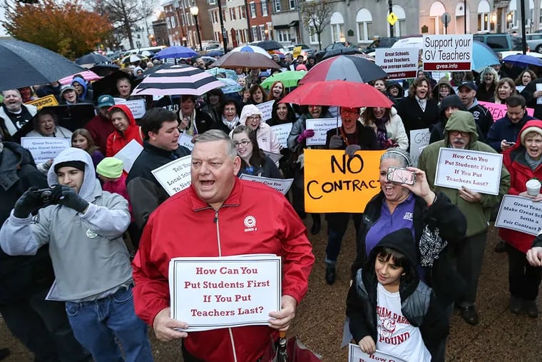 Teachers and staff from five Delaware County districts without contracts rally in front of Media Courthouse on Thursday, November 13, 2014. ( Steven M. Falk / Staff Photographer )