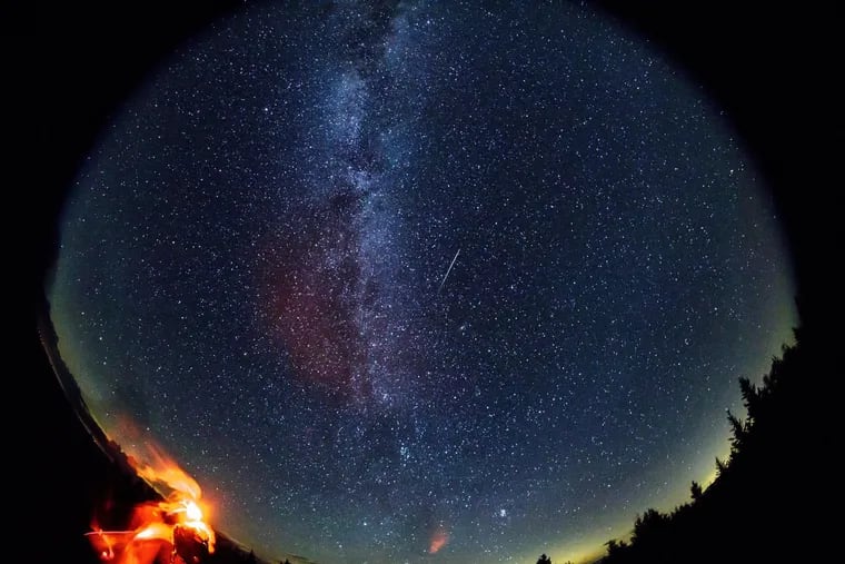 In this 30-second exposure taken with a circular fish-eye lens, a meteor streaks across the sky during the annual Perseid meteor in August 2016 in Spruce Knob, W. Va.