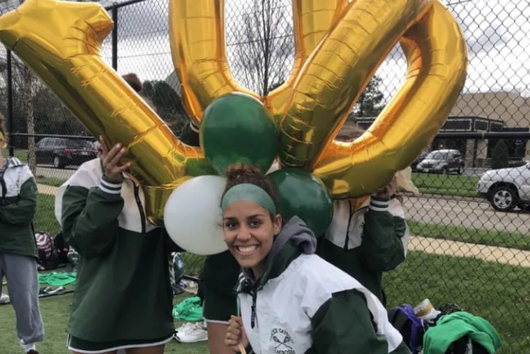 Camden Catholic’s Camille Pottillo celebrates her 100th goal.