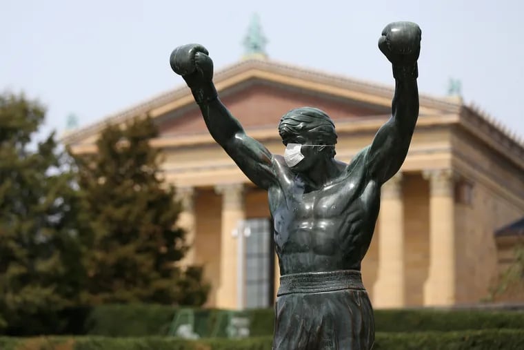 A mask covers the face of the Rocky statue in front of the Philadelphia Museum of Art on Friday, April 17, 2020.