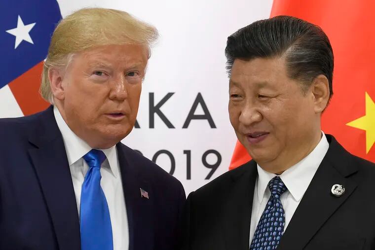 In this June 29, 2019, file photo, U.S. President Donald Trump poses for a photo with Chinese President Xi Jinping during a meeting on the sidelines of the G-20 summit in Osaka, western Japan. Chinese Commerce Ministry spokesman Gao Feng said Beijing is working to resolve conflicts with Washington over trade, dismissing speculation the talks might be in trouble as unreliable “rumors.” Trump had said he hoped to sign a preliminary agreement with Xi by this month.