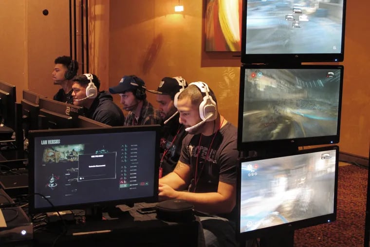 Video game players compete against one another in an esports tournament at Caesars casino in Atlantic City in 2017. Video gamers in the United States and elsewhere will soon be able to bet on themselves. The live-betting esports platform Unikrn had its wagering license approved by the Isle of Man on Tuesday clearing the way for users to legally gamble on competitive video games.