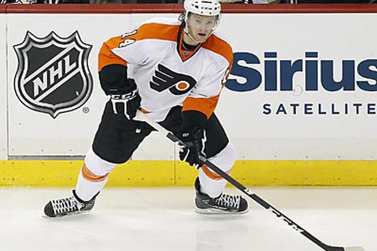 Sean Couturier injured his leg in the first period of Thursday's overtime loss. (Yong Kim/Staff Photographer)