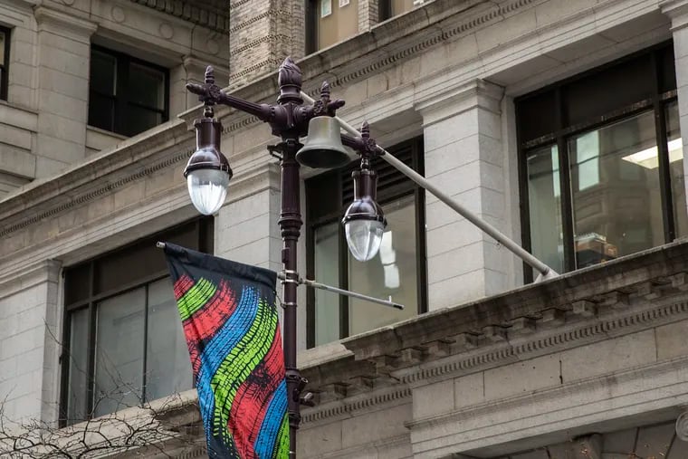 A bell hangs from a light pole on the west side of Broad street between Chestnut and Sansom on Wednesday, Jan. 09, 2019. The city unveiled nearly-40 bells in 1996, which used to play melodies, but the bells haven't rang for about 20 years.
