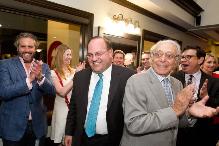 City Council candidate Allan Domb (center) is greeted by applause as he arrives at his election-night celebration at Smith & Wollensky restaurant in Rittenhouse Square on May 19, 2015.