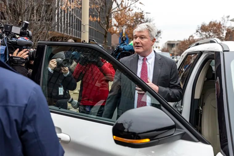 John Dougherty stands ducks into an awaiting car outside the federal courthouse in Center City Philadelphia on Thursday after being found guilty of nearly all charges in his union embezzlement trial.