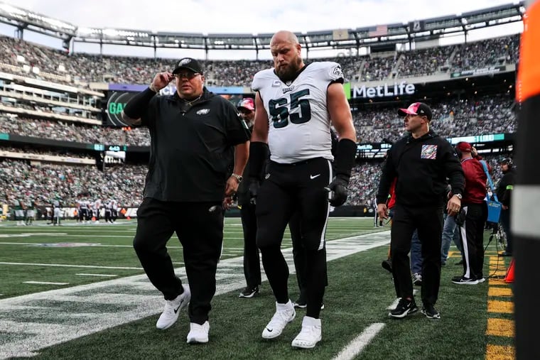 Philadelphia Eagles offensive tackle Lane Johnson limps down the sideline during the first quarter of the game against the New York Jets at MetLife Stadium in East Rutherford, NJ on Sunday, October 15, 2023.