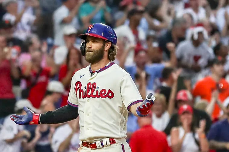 Phillies designated hitter Bryce Harper hit a game-tying three-run home run in the ninth inning Wednesday against the Giants.
