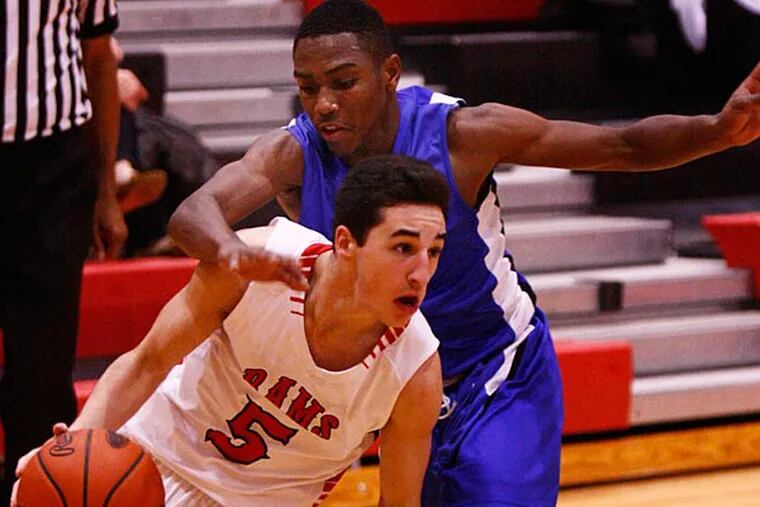 Harriton's Will Esposto (5) drives the right baseline against Academy
Park's Jawan Collins in the second quarter. Academy Park went on to
win the nonleague boysâ€™ basketball game, 66-55, Saturday (12/20/14)
at Harriton. (LOU RABITO / Staff)