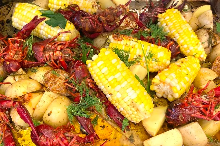 Lowcountry boil with crawfish, shrimp, andouille, corn, and potatoes is a dish that can be separated into social-distance servings.