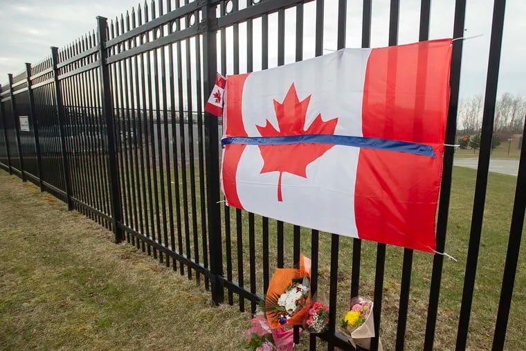 A tribute is displayed Monday at the Royal Canadian Mounted Police headquarters in Dartmouth, Nova Scotia, following a weekend rampage by a gunman disguised as a police officer.