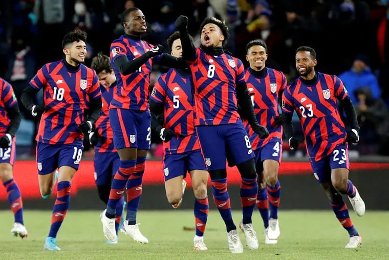 Weston McKennie (8) celebrates with teammates after scoring the United States' opening goal.
