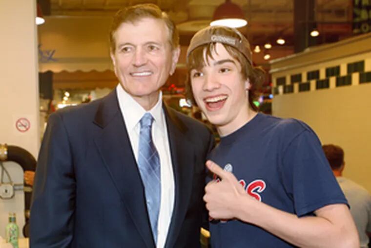 Tom Knox posing with Kyle Ejsmont at the Reading Terminal Market.
