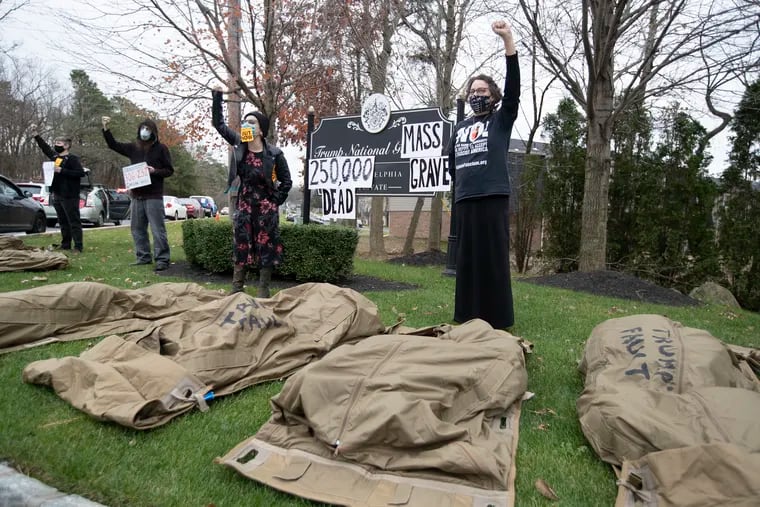 Members of Refuse Fascism traveled in a car caravan from West Philadelphia to Trump National Golf Club in Pine Hill, NJ on Nov. 21, 2020 to lay out mock body bags in protest of President Trump’s handling of the COVID-19 pandemic. They renamed the course the Trump National Mass Grave.