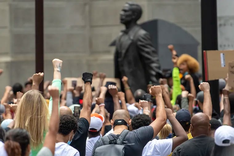 People gather for a Justice for George Floyd protest at the Octavius V. Catto Monument, in South Penn Square, Philadelphia, May 31, 2020.