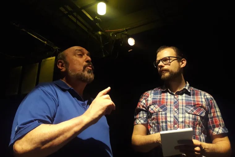 Gene Terruso (left), founder of BEST Divadlo, the first English-language theater in Brno, Czech Republic, confers with technical director Honza Čapek on stage.