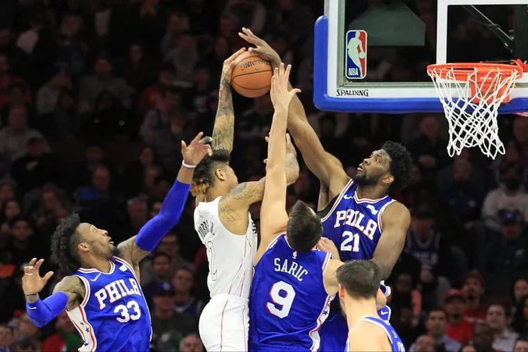 Joel Embiid blocks a shot by Kelly Oubre in the Sixers win over the Wizards Tuesday night at the Wells Fargo Center.