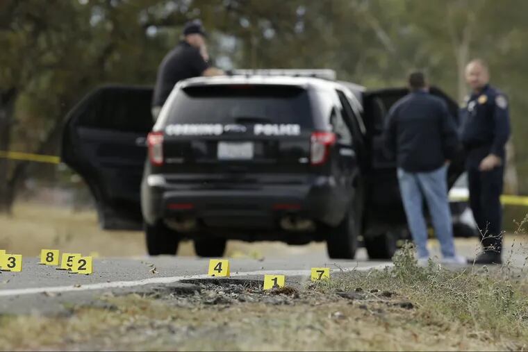 Yellow tags mark where bullet casings found at one of the scenes of a shooting spree at Rancho Tehama Reserve, near Corning, Calif., Tuesday, Nov. 14, 2017.