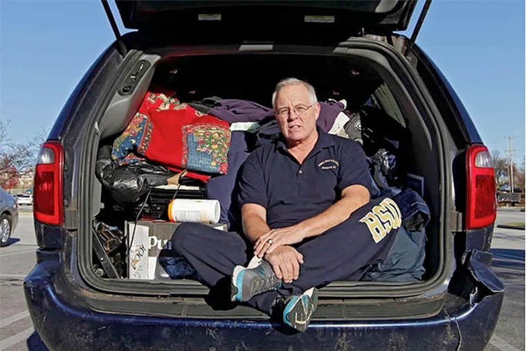 Robert Freniere in the van where he lives. &quot;He's done a lot of things. . . . He's got the gift of gab. Very smart,&quot; said Adm. James Hogg, who officiated at Freniere's retirement.