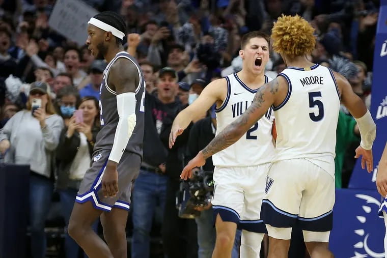 Villanova's Collin Gillespie and Justin Moore celebrate after their victory over Seton Hall at the Wells Fargo Center.