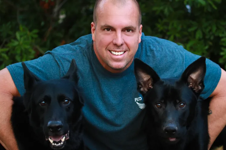 Greg Browne 53, died Jan. 1, 2020 after a long fight with lymphoma. He is shown here with two shepherds, Cash and Axis.