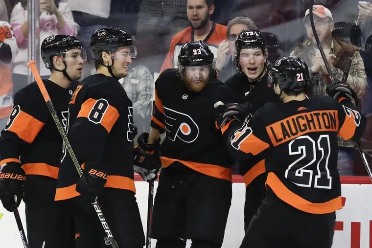 The Flyers' Jakub Voracek celebrates with his teammates after scoring a goal in an October game. The NHL announced a partnership to share data with a casino operator, following in the NBA's lead.
