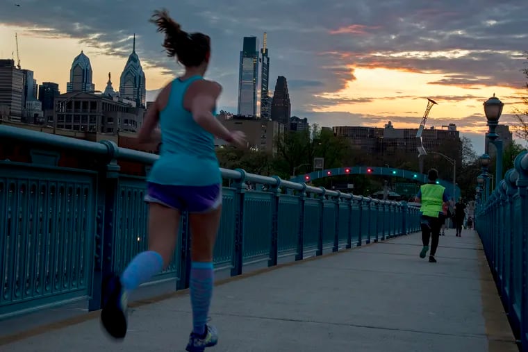 Runners tackle the cardio-challenging Ben Franklin Bridge -- and get a magnificent sunset view as a reward.